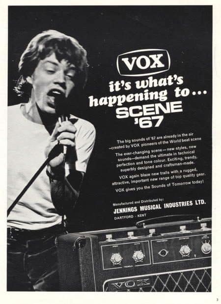 Mick Jagger is in a old Vox Amplifier print advertisement in black and white. And he has his mouth open like a frog. And he looks STUPID. AND MICK JAGGER IS A TOTAL ASSHOLE.... 