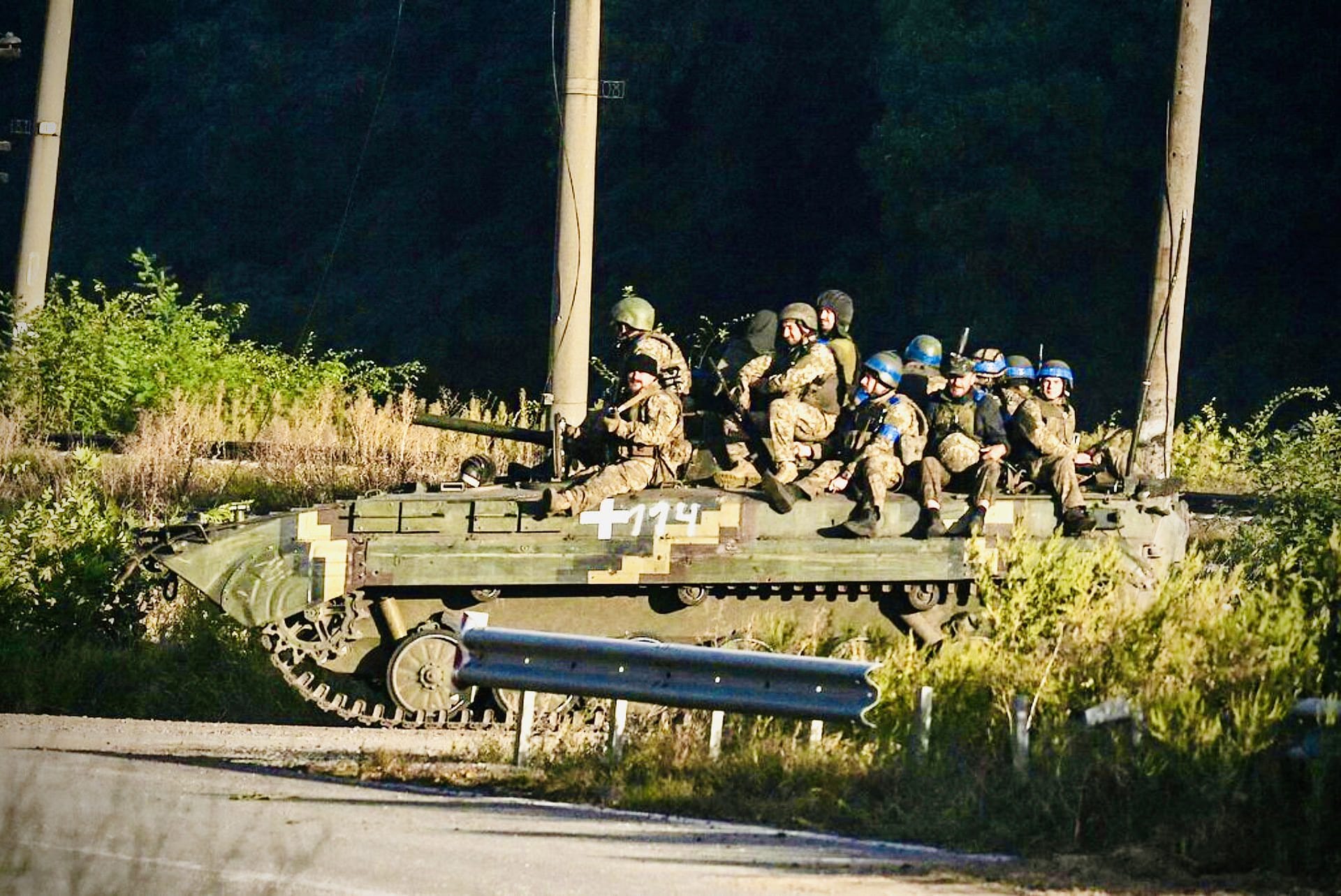 Ukrainian fighters in Kharkiv on Friday. President Volodymyr Zelensky said his military had captured large chunks of occupied territory in the north.