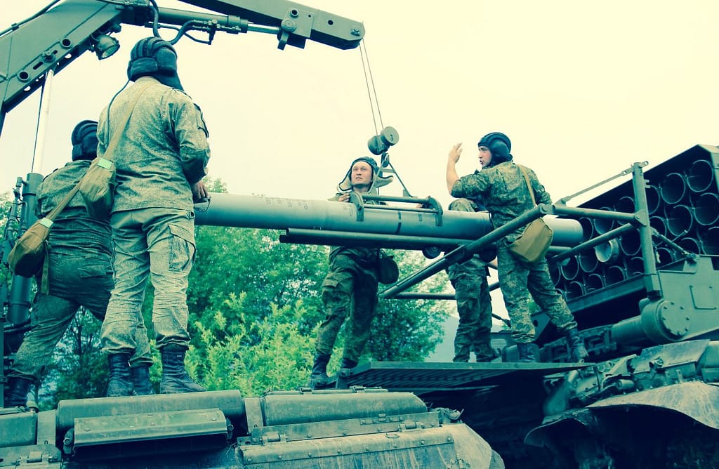 Russian servicemen load 200mm thermobaric warheads onto a TOS-1A vehicle